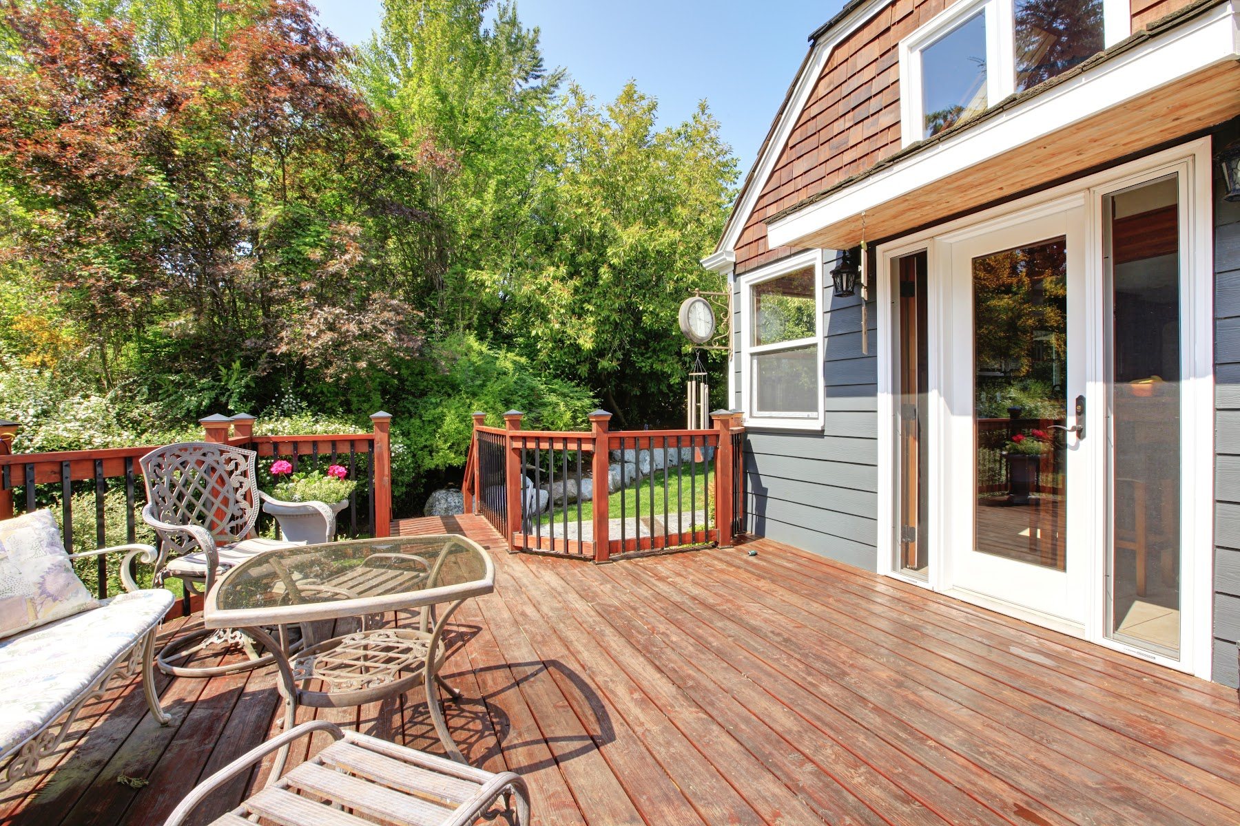 Backyard deck connected to the home with outdoor seating
