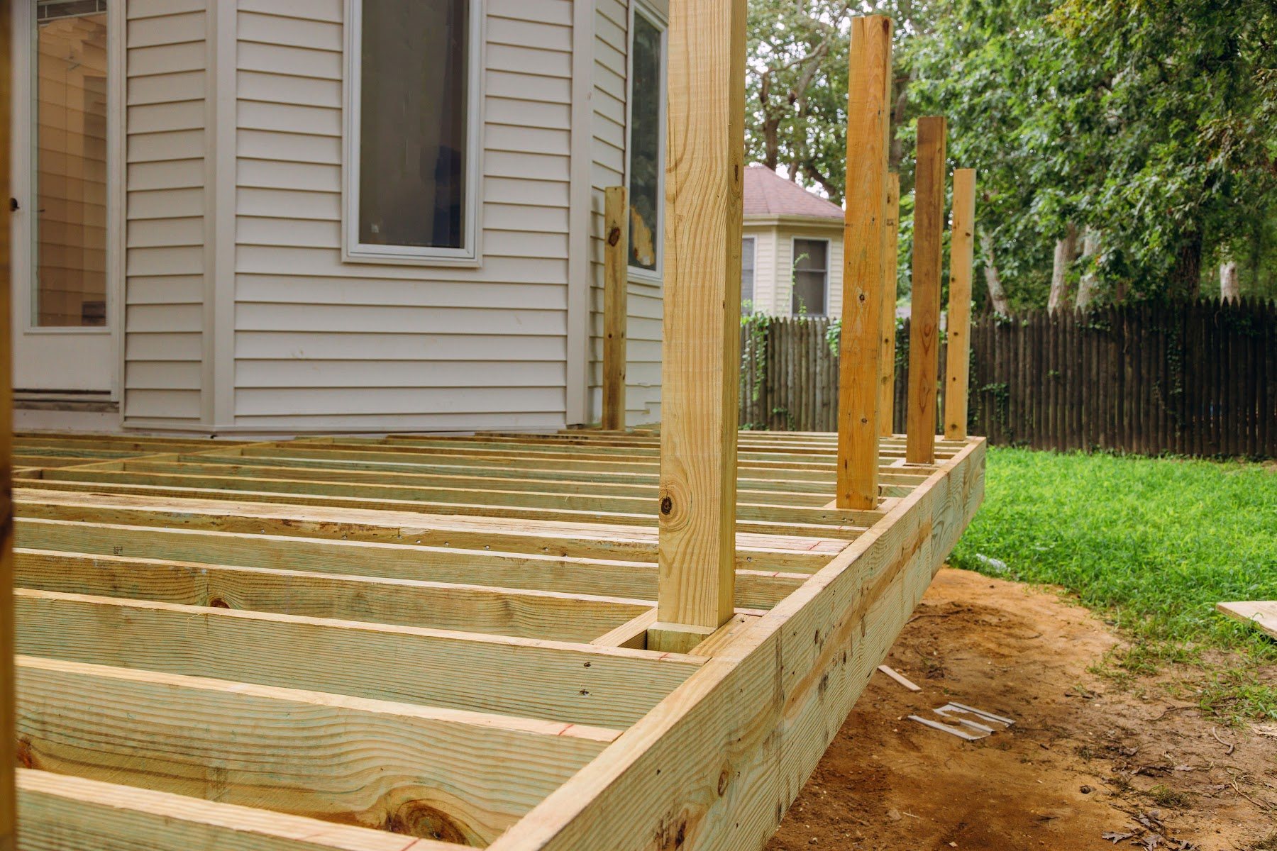Rebuilt wood deck stairs and landing at a residential entry