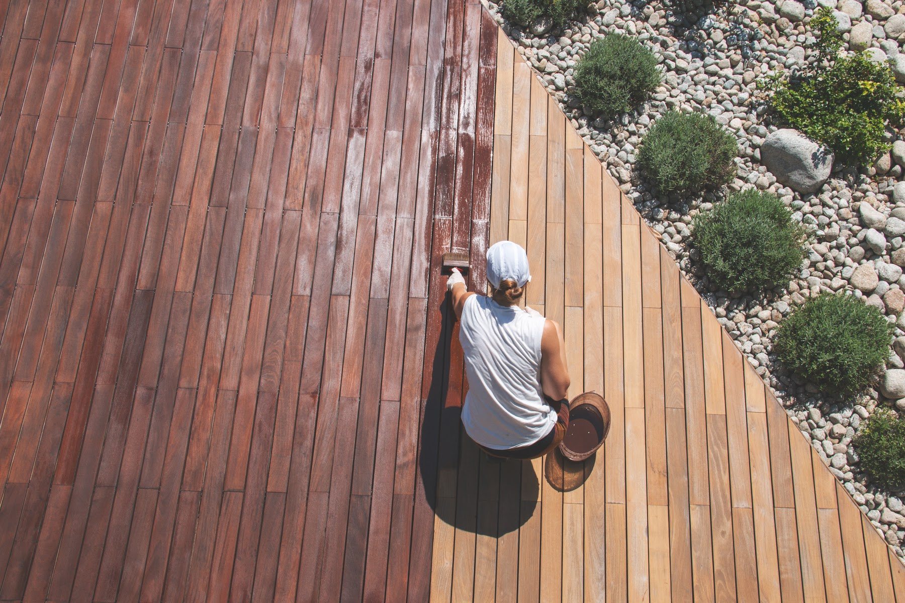 Wood deck being treated with a protective finish