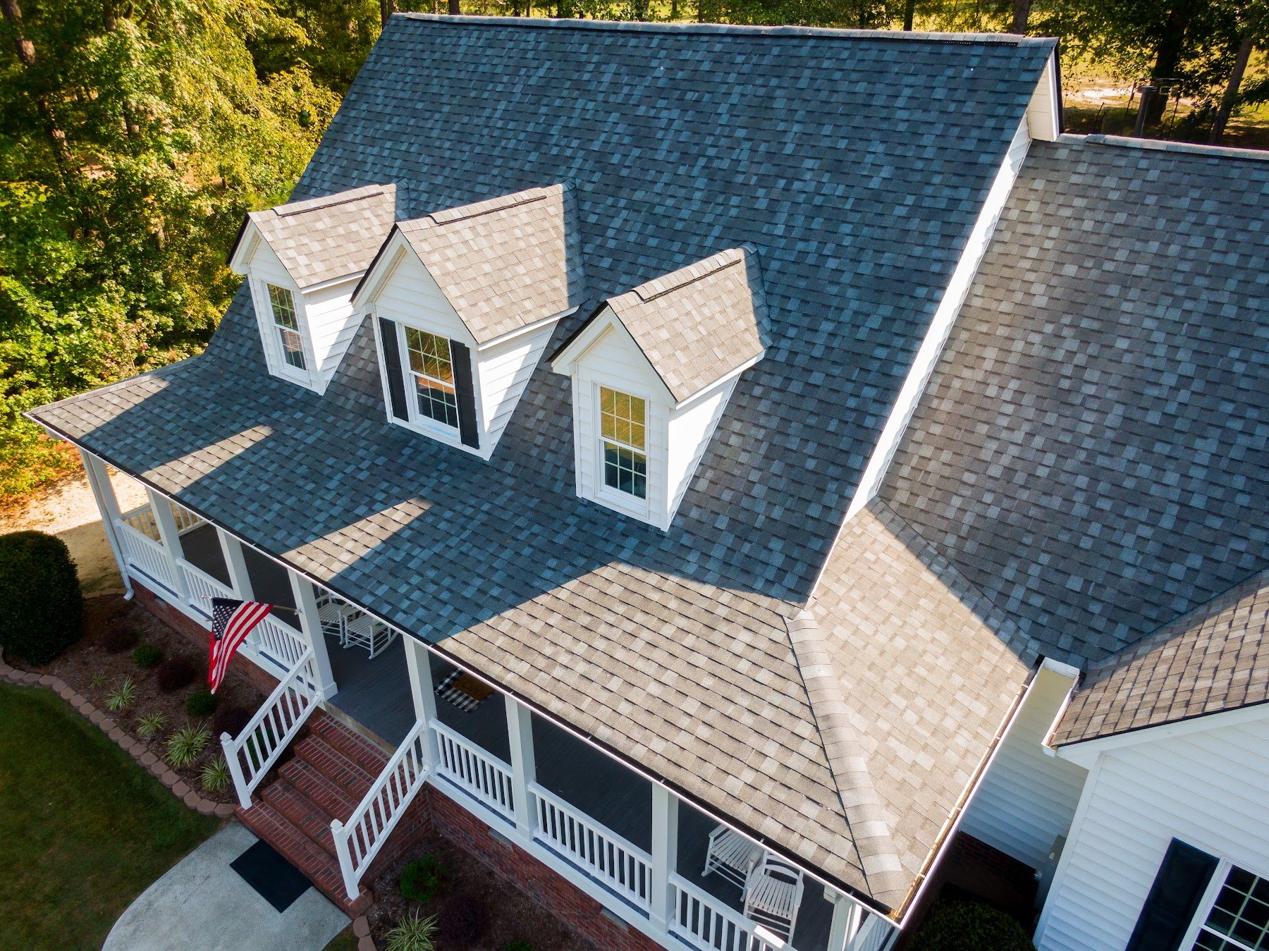 Aerial view of a complex residential shingle roof