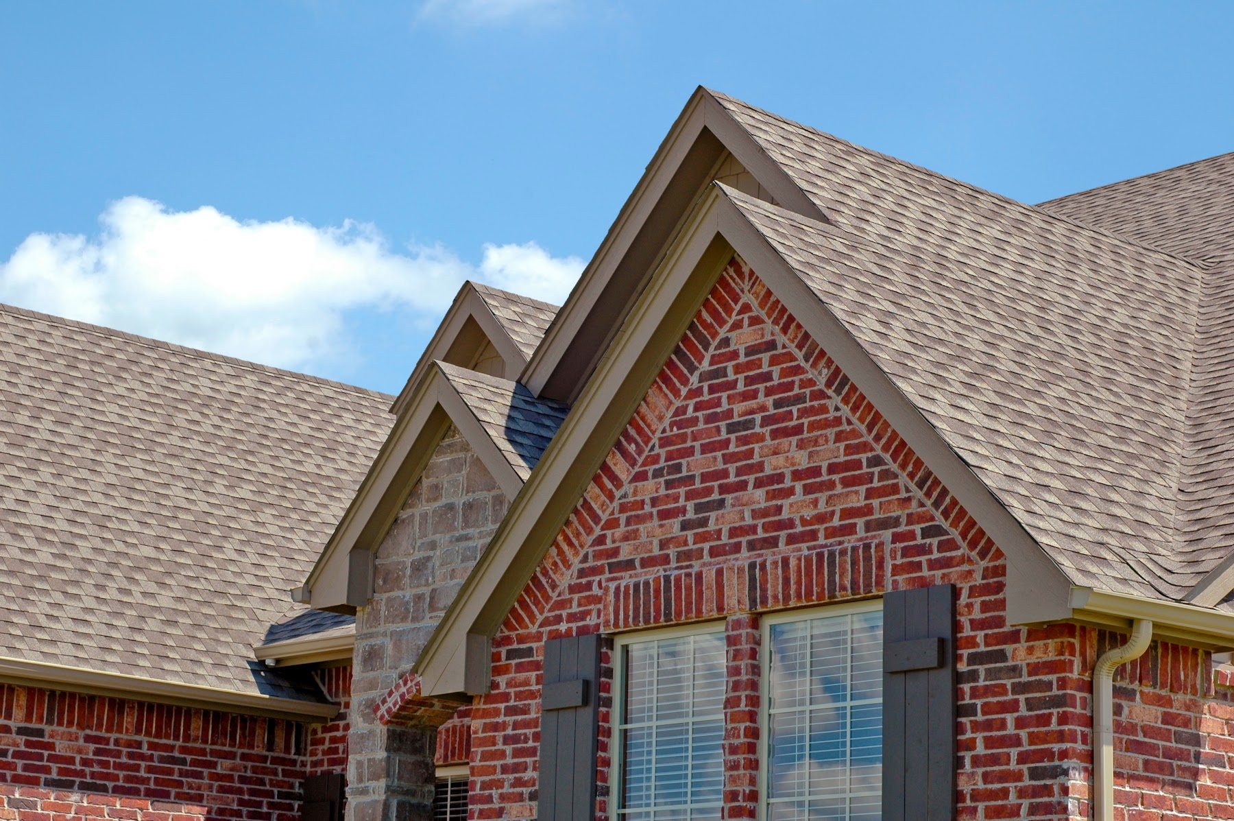 Brick home with new dimensional asphalt shingles