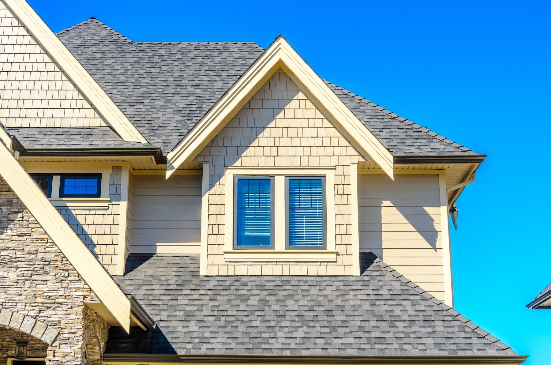 Gabled home with gray architectural shingle roofing