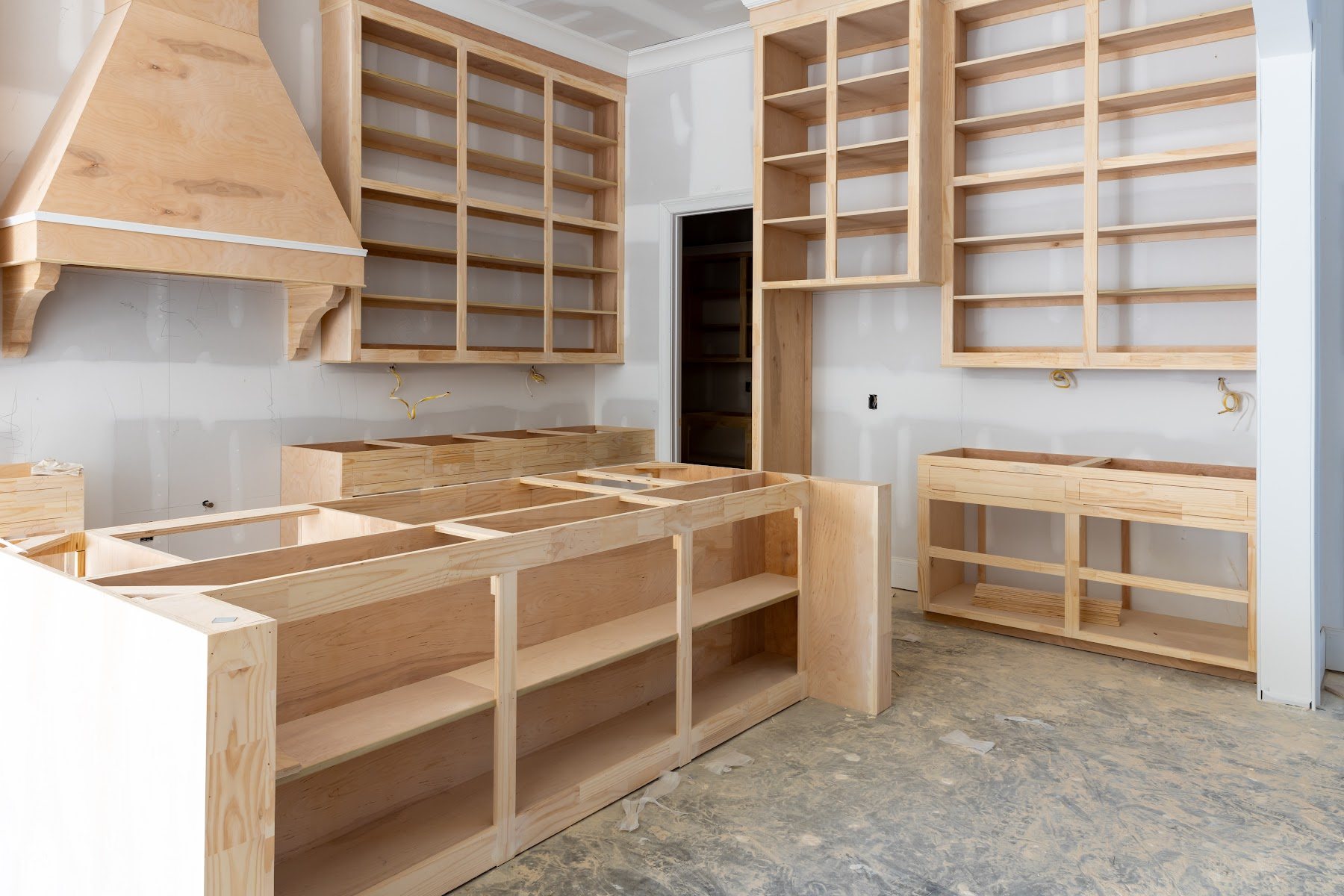 Custom kitchen cabinetry being installed during a home remodel