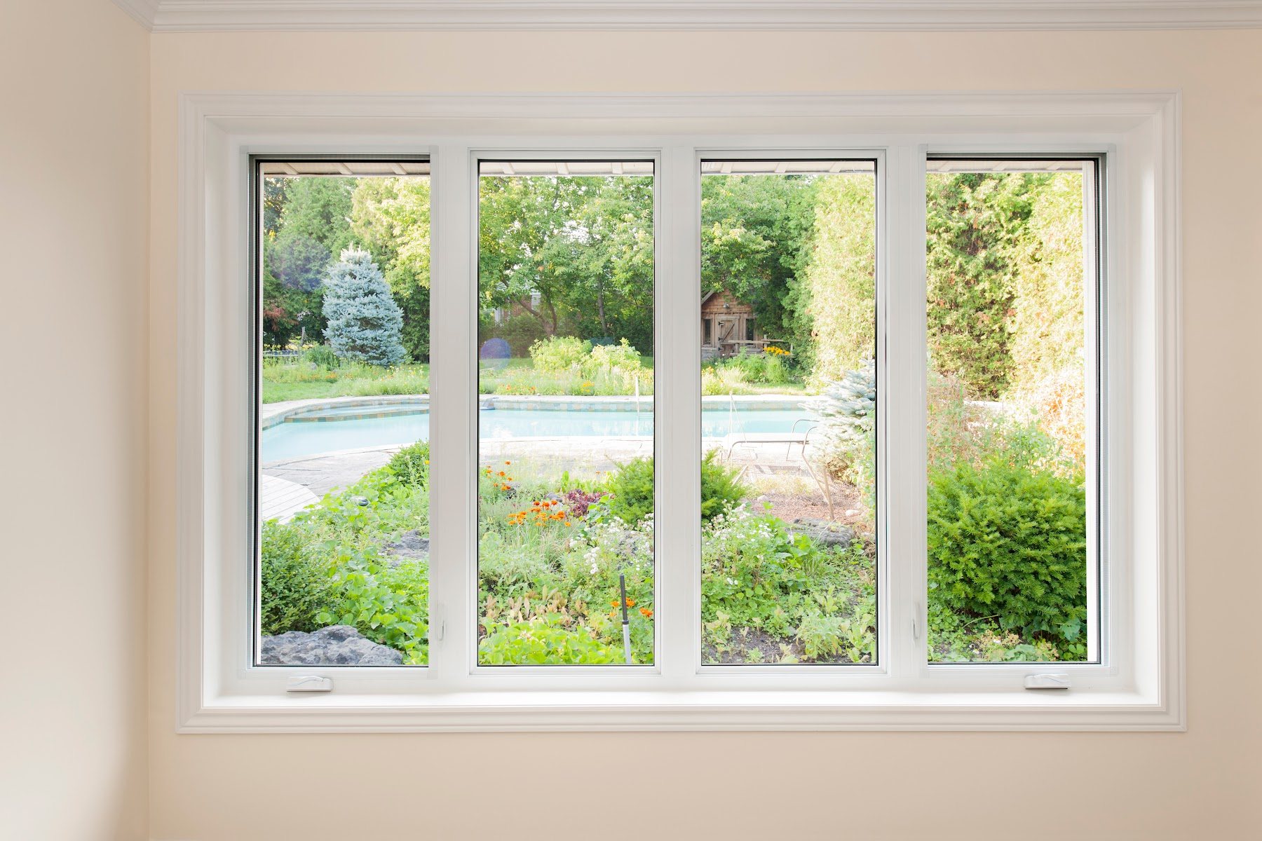 White-framed replacement window installed in a finished room
