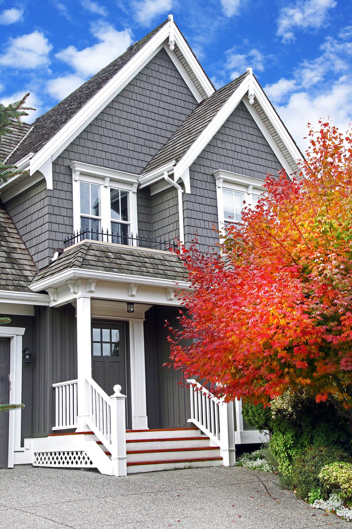 Two-story home with lap siding, trim, and covered front entry